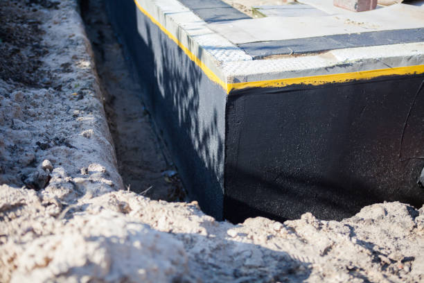 Professional Waterproofing technician working in Holgate, OH